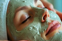 Woman getting a facial mask face spa forehead.