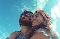 Middle eastern couple hugging sunglasses portrait smiling.