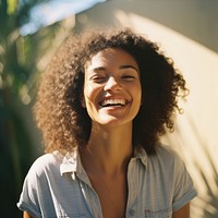 A mixed race american-african woman laughing smiling summer.