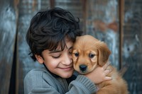 Middle eastern boy kissing his puppy portrait smiling mammal.