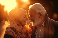 Senior Middle eastern couple taking care each other smiling sunset adult.