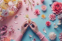 Person hand making papercraft flowers petal plant rose. AI generated Image by rawpixel.