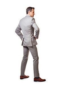 A bussinessman getting lower back pain standing walking tuxedo.