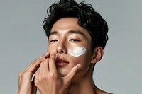 Korean man cosmetics applying adult.