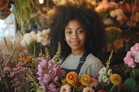 Multi ethnic florist at flower shop portrait plant photo.