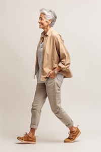 A senior woman walking in studio adult retirement wristwatch.