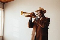 Black senior man holding trumpet musician photo saxophonist. AI generated Image by rawpixel.