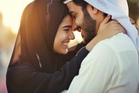 Young wealthy middle eastern couple hugging happy love.