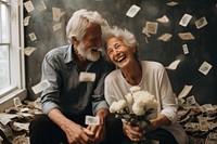 Old happy couple saving money laughing adult togetherness.