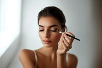 A woman brush cosmetics applying.