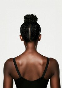 An African-American woman back adult white background.