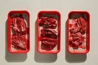 Three trays of food trays with meat beef red freshness.