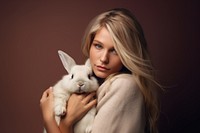 Person hugging a rabbit portrait animal mammal.