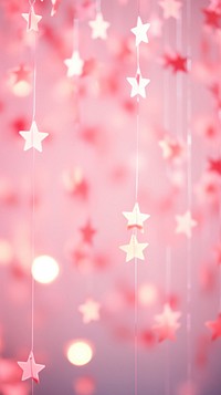 Pink star bokeh wallpaper illuminated backgrounds celebration.