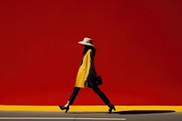 A minimalistic photography of a lady crossing the road advertisment style footwear walking adult.