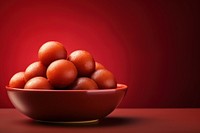 A minimalistic photography of Gulab Jamun in advertisment style food bowl simplicity.
