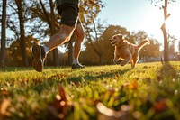 Man running with her dog in park mammal animal pet.