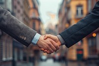 Two businessmen holding hands handshake adult architecture.