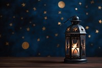 Ornamental Arabic lantern night glowing burning.