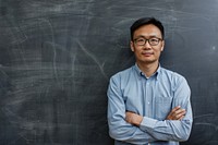 Asian man teacher cross arm against black board blackboard glasses adult.