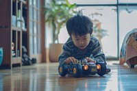 Boy playing car robot toy child innocence portrait.