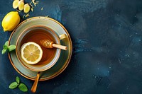 Cup of Ginger tea with lemon and honey fruit plant food.