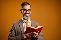 Happy teacher holding book reading adult smile.