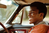 Photo of happy teenager african american man driving car portrait vehicle transportation.