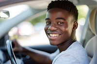 Photo of happy teenager african american man driving car portrait vehicle smile.