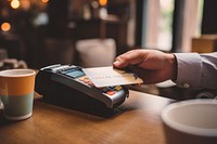 Adult man paying hand credit card electronics.