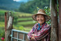 Asian old woman smiling farmer cowboy.
