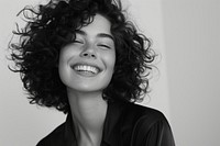 Woman with curly hair smiling portrait adult smile.