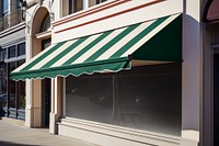 Shopfront with green striped canopy