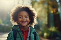 Elementary school African-American girl portrait smiling nature.