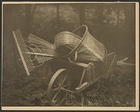 Wheelbarrow with tools by Arnold Genthe