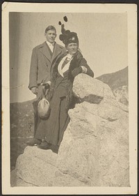 Man and Woman Standing on Rocky Perch by Louis Fleckenstein
