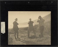 Three Men Standing on Hillside with Hands before Their Faces by Louis Fleckenstein