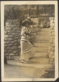 Woman with Camera on Steps by Louis Fleckenstein