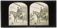 Unidentified British man wearing a top hat on horseback, another unidentified British man holding the bridle of the horse
