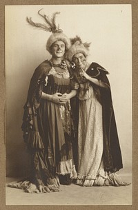 Man and woman in costume, wearing feathered hats by A Louis Mojonier