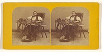 Portrait of Charles H. Barnes, Hardwick, Mass. seated in handicapped-style chair making wooden picture frames by George T Putnam