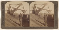 Gigantic steam shovel dumping 5-ton load of iron ore into car, "open-pit" mine, Hibbing, Minn. by Underwood and Underwood
