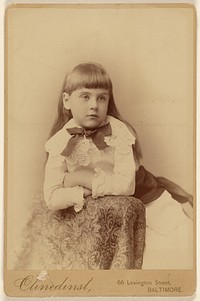 Unidentified little girl posed against a chair back by Barnett M Clinedinst