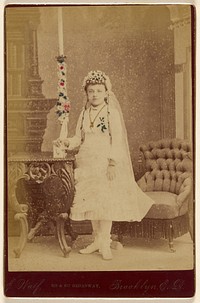 [Portrait of a girl wearing a white dress and veil]. by J Wolf