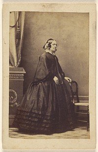 Unidentified woman, standing by Liddiard