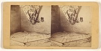 Room with odd ceiling, chair draped with patterned cloth, pair of woman's shoes hung on wall