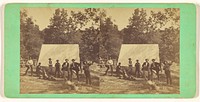 Group of men posed in front of a tent