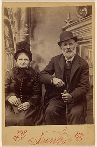 Unidentified old woman and bearded old man, seated, both wearing hats by Frank s Fine Art Car