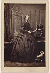 Unidentified woman holding a book,standing by Camille Silvy