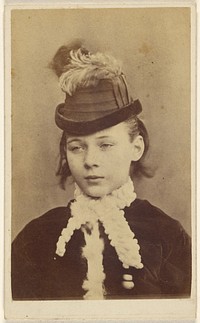 Young girl wearing a white collared velvet dress and hat